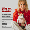 Kaley Cuoco wearing red Freeloader Dog Hoodie with text: Why we love our hoodies, All natural products, Breathable cotton, Cozy AF, Sustainable materials, Family AF
