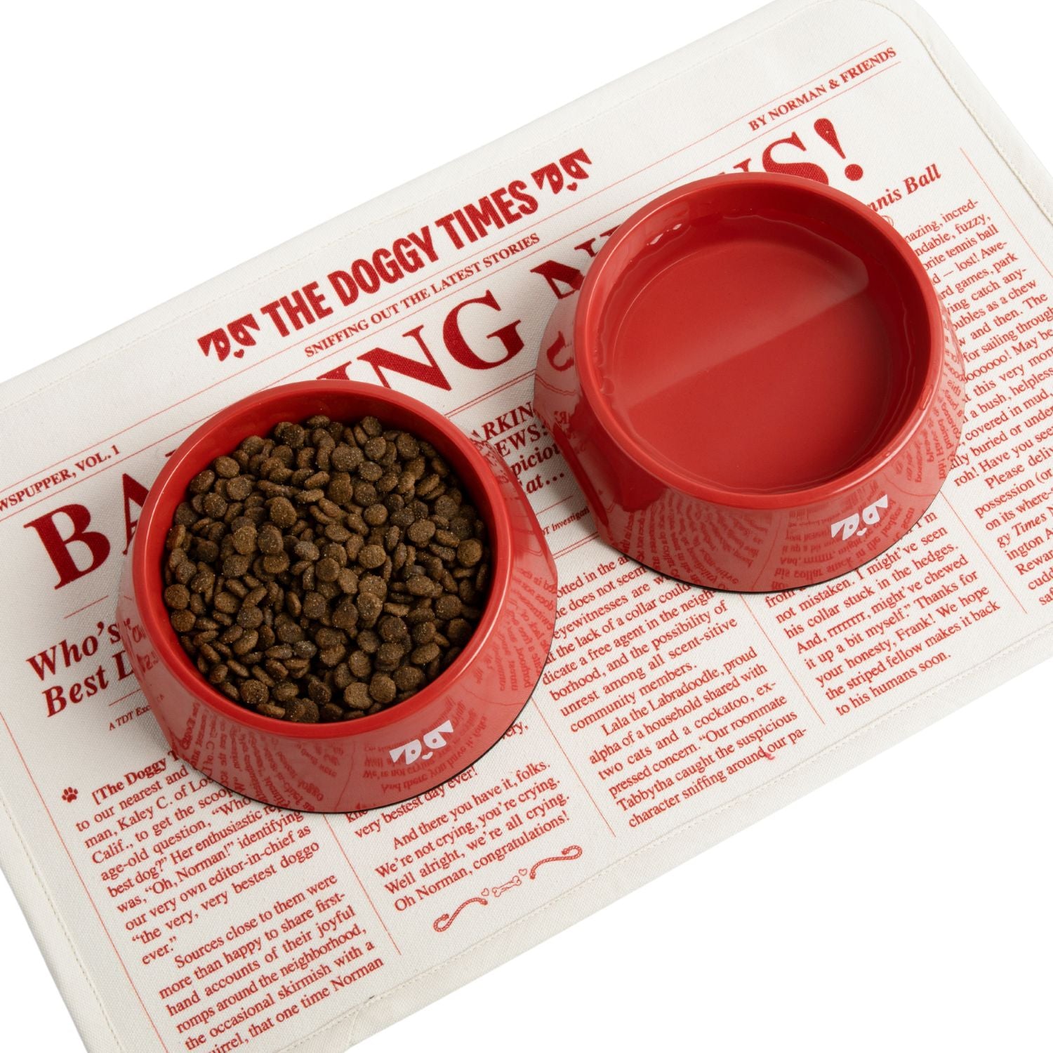 Red Oh-riginal bowl filled with food on a newspaper with headline 'BARKING' and text 'OH-RIGINAL RED BOWL'.