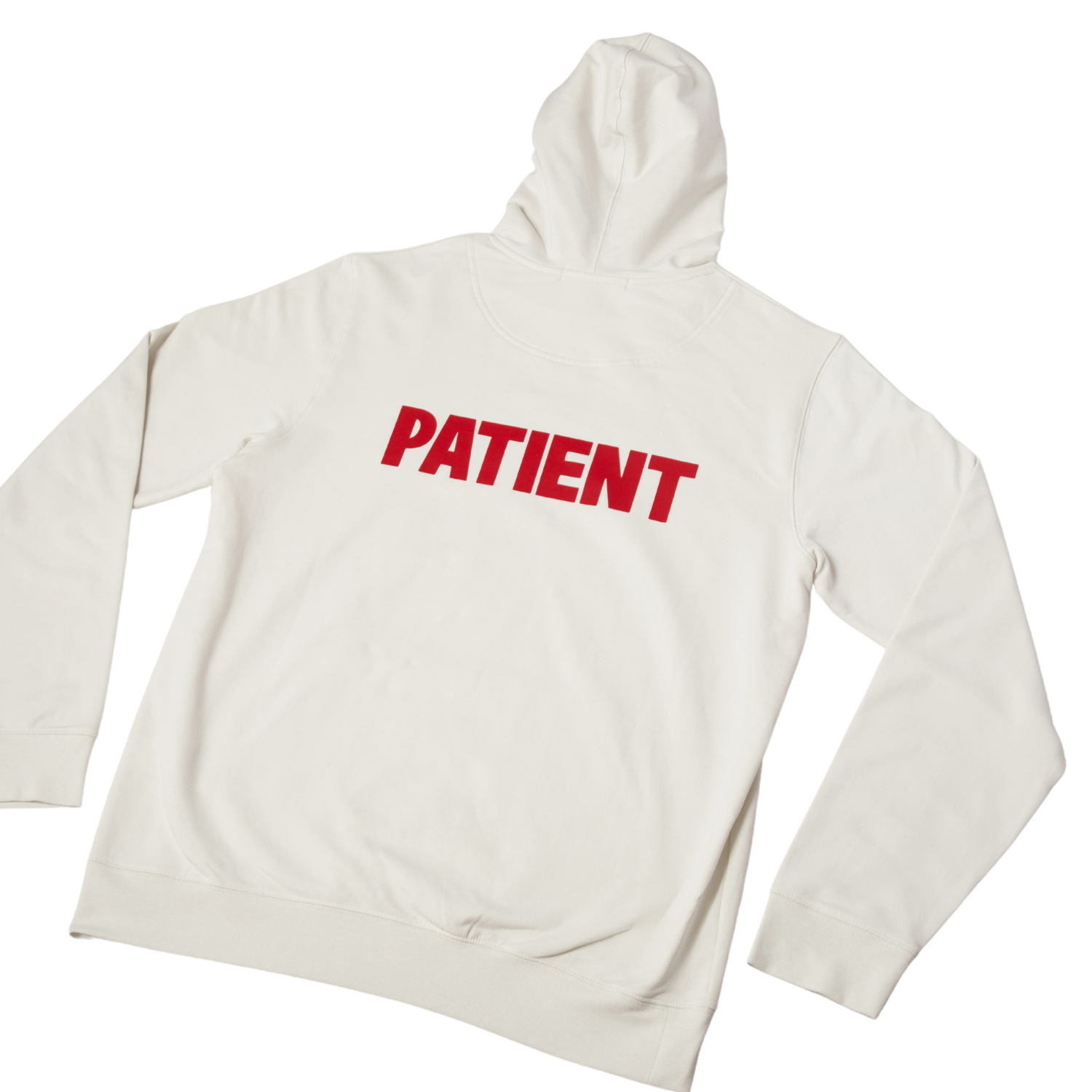 White hoodie with the word PATIENT printed in red on the back