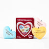 Heart-shaped plush toys with texts: 'FUR-EVER MINE', 'I WOOF YOU', 'BUTT SCRATCHIES', and a red box labeled 'SWEETHEARTS' showing hearts with texts 'LOVE YOU', 'SNAX PLZ', 'BFF', 'BUTT SCRATCH', 'GOODDEST DOGGO'.