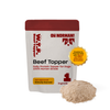 Front view of Oh Norman Beef Topper pouch showcasing Beef Topper label, vet approved badge, 1 ingredient mark and pile of powdered topper on white background