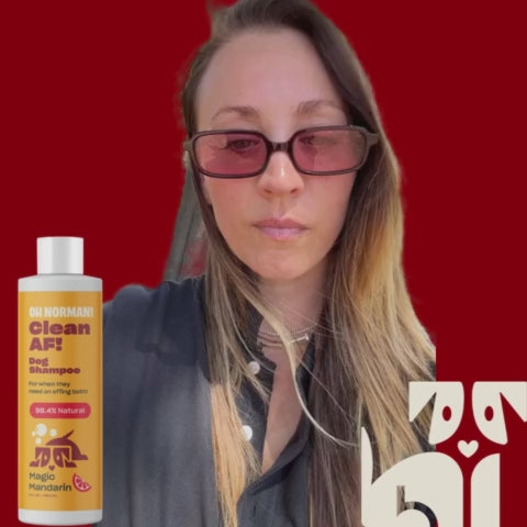 Woman wearing sunglasses with a yellow haircare bottle labeled 'Clean AF' at left
